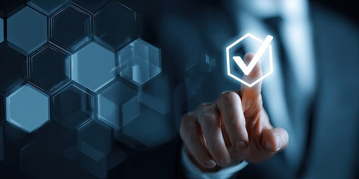 A hand presses a glowing checkmark on a digital interface of hexagons