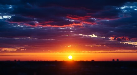 Fototapeta premium Dramatic sunset with orange and purple sky above the horizon