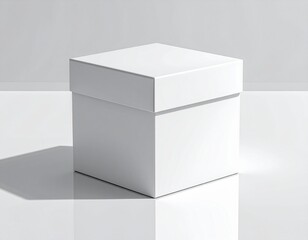 A pristine white square box with a lid, sitting on a reflective surface, casting a shadow.