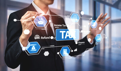 A business professional engages with a digital interface showcasing tax-related information and icons, symbolizing modern finance solutions in an office setting. Tessel
