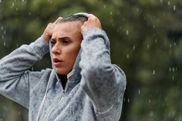 Woman Resting in the Rain After Intense Run