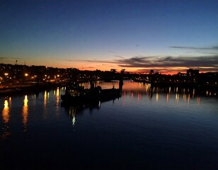 City skyline at dusk over a river