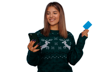 Woman online shopping for holidays, using smartphone and credit card, wearing christmas sweater, transparent background