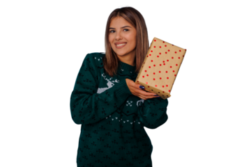 Happy woman holding a christmas gift, smiling and celebrating festive holiday season with presents
