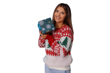 Happy young woman in christmas sweater holding holiday gift, smiling in festive season, transparent background