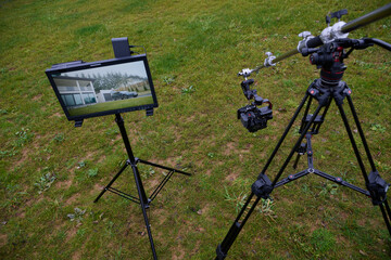 Videography team setting up the professional equipment and cameras for a high-quality music video shoot.