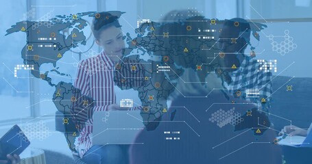 business colleagues gathering in lounge and reviewing printed charts, generating world map overlay - Powered by Adobe