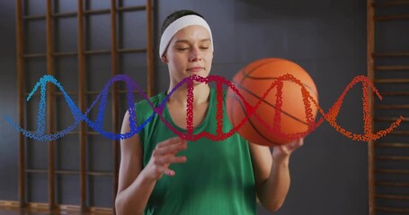 Female athlete shifting basketball spinning on fingertip as helix pulses in education demo - Powered by Adobe