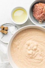 Overhead view of mise en place of ingredients for making moi moi