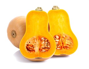 Two halves of a butternut squash, next to a whole one, on a white background
