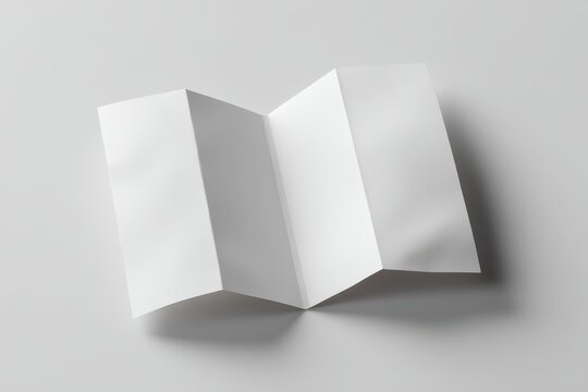 Blank White Z-Fold Brochure Mockup with Crisp Folds and Subtle Shadows on a Minimalist Grey Surface.