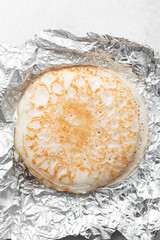 Overhead view of a plate of sinasir, top view of food from northern nigeria sinasir rice pancake, nigerian ethnic foods