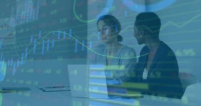 Financial chart overlay animating analysis as two consulting women opening laptop annotating data - Powered by Adobe