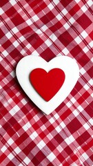 Two hearts on red and white checkered fabric