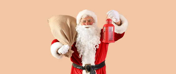 Santa Claus with bag and Christmas lantern on beige background