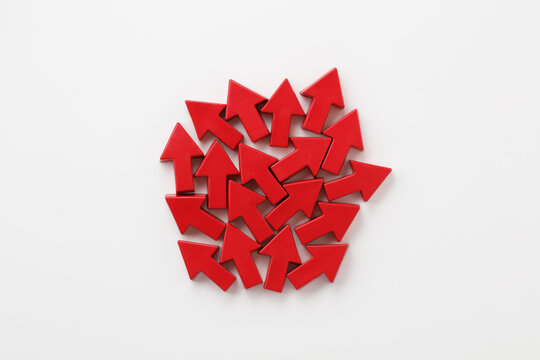 red arrow-shaped objects on a white background