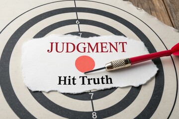 Target with the word 'Judgment' and 'Hit Truth' emphasized, showcasing a dart poised for accuracy