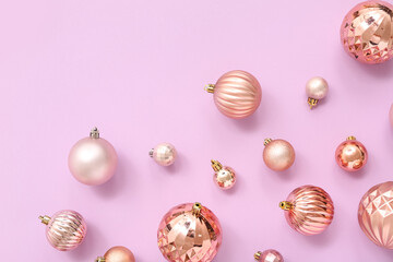 Composition with Christmas balls on lilac background