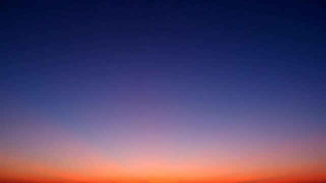 A smooth, captivating gradient of colors transitions across the sky from horizon to zenith during twilight tranquil, smooth captivating gradient, moody