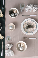 Beautiful table setting with burning candles and Christmas decorations, top view