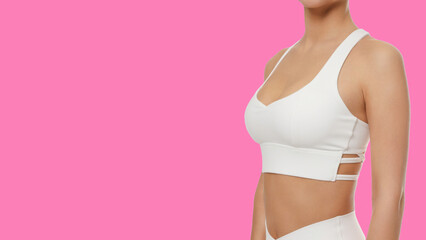 Woman in white athletic wear supports cancer awareness efforts