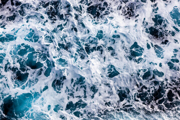 Sea surface background. Aerial view of vibrant foamy water. Can be used in covers, packaging, posters, textures, wallpapers, art and design projects. Stunning vector illustration.