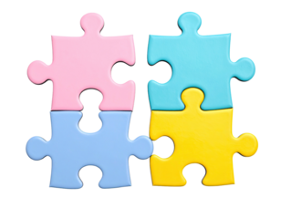 Four brightly colored puzzle pieces, slightly detached, isolated on black