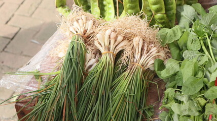 vegetable chives in stalls of Indonesian traditional market sellers