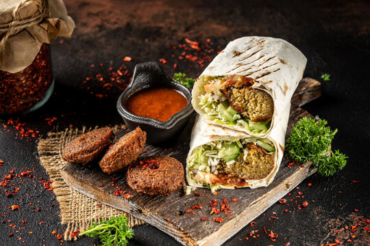 Falafel wrap with fresh vegetables and sauce