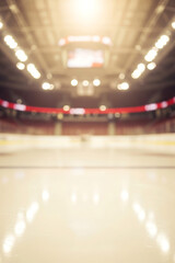 Empty ice hockey arena with bright lights above