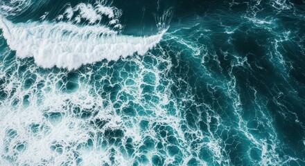 Fototapeta premium Aerial view of ocean waves crashing, capturing the dynamic textures and patterns of the sea's surface, showing beautiful patterns of the sea