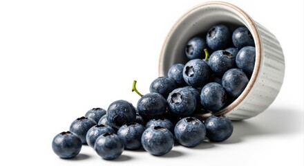 Plump Indigo Blueberries Spilling from a Ceramic Ramekin, High-Key Lit on Pristine White Background