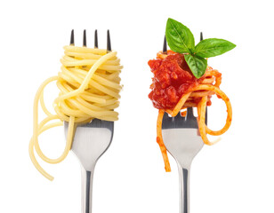 Two forks each holding spaghetti; one plain, one with sauce and basil