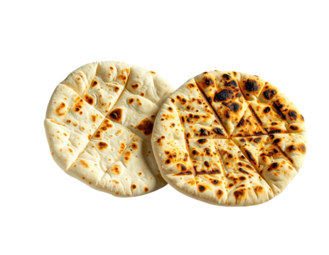 Two round, textured flatbreads, one whole and one cut into triangles, on black