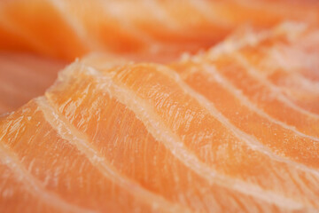 Fresh salmon fillets close up on a surface