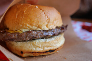 Mouthwatering burger with cheese in a soft bun
