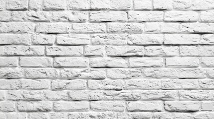 Obraz premium A white brick wall with a few bricks missing. The wall is very plain and simple. It is a very basic and simple design