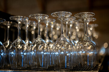 Elegant arrangement of crystal wine glasses shining under soft lighting at a cozy venue