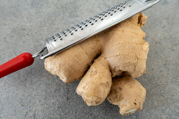 Stockholm, Sweden Ginger root with agrater.