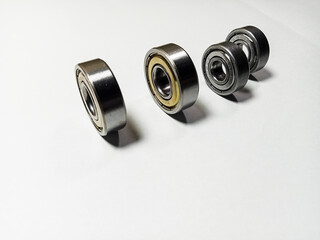 group bicycle bearing, motorcycle bearing, metal bearing isolated on white background, machine part component, as a mechanical technology design of industrial manufacturing machines, space for tek 
