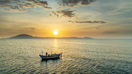 Fishing boats off the coast of Doc Let, Nha Trang, Vietnam at dawn. The main means of offshore...