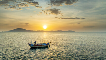 Fishing boats off the coast of Doc Let, Nha Trang, Vietnam at dawn. The main means of offshore fishing for fishermen in central Vietnam