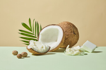 Front view of coconut shells, creamy shea butter, and nuts arranged together, photographed with bright pastel tones for spa, skincare, and natural product ads.