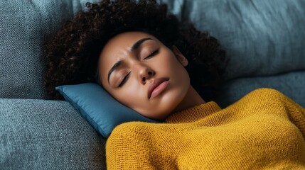 Woman Relaxing on Sofa with Heating Pad for Comfort and Relief at Home
