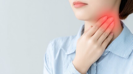 Fototapeta premium Sore Throat: A close-up shot of a person, her hand gently touching her inflamed neck as she battles the ache and discomfort.