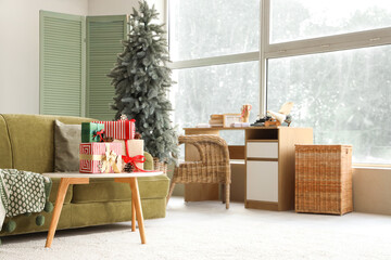 Stylish interior on light living room with Christmas tree and gifts on table
