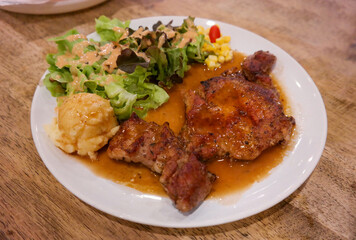 pork steak on plate in restaurant