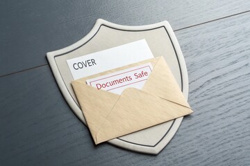 Secure envelope resting on a protective shield with labeled documents, promoting safety and organization