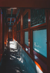 Beijing's weathered wooden structure displays intricate, golden carvings featuring a symmetrical...