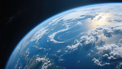 Obraz premium Earth viewed from space, showcasing blue oceans, white clouds, and curved horizon under sunlight